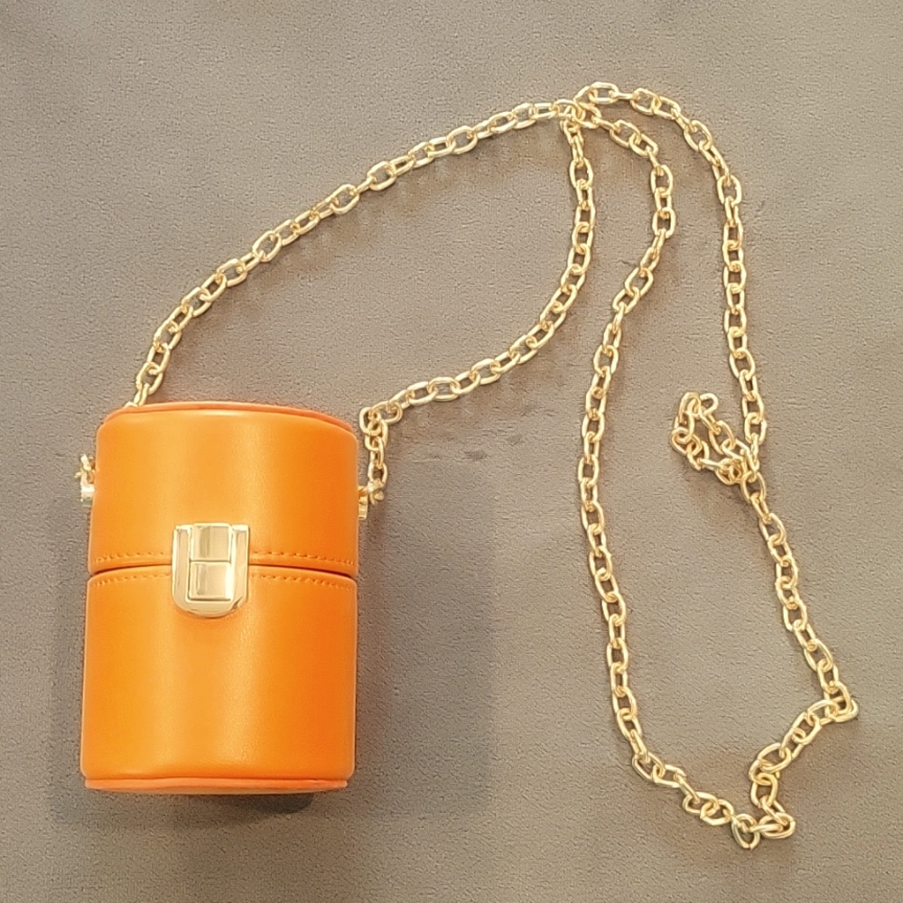 Cute Orange case on Gold Tone chain strap.